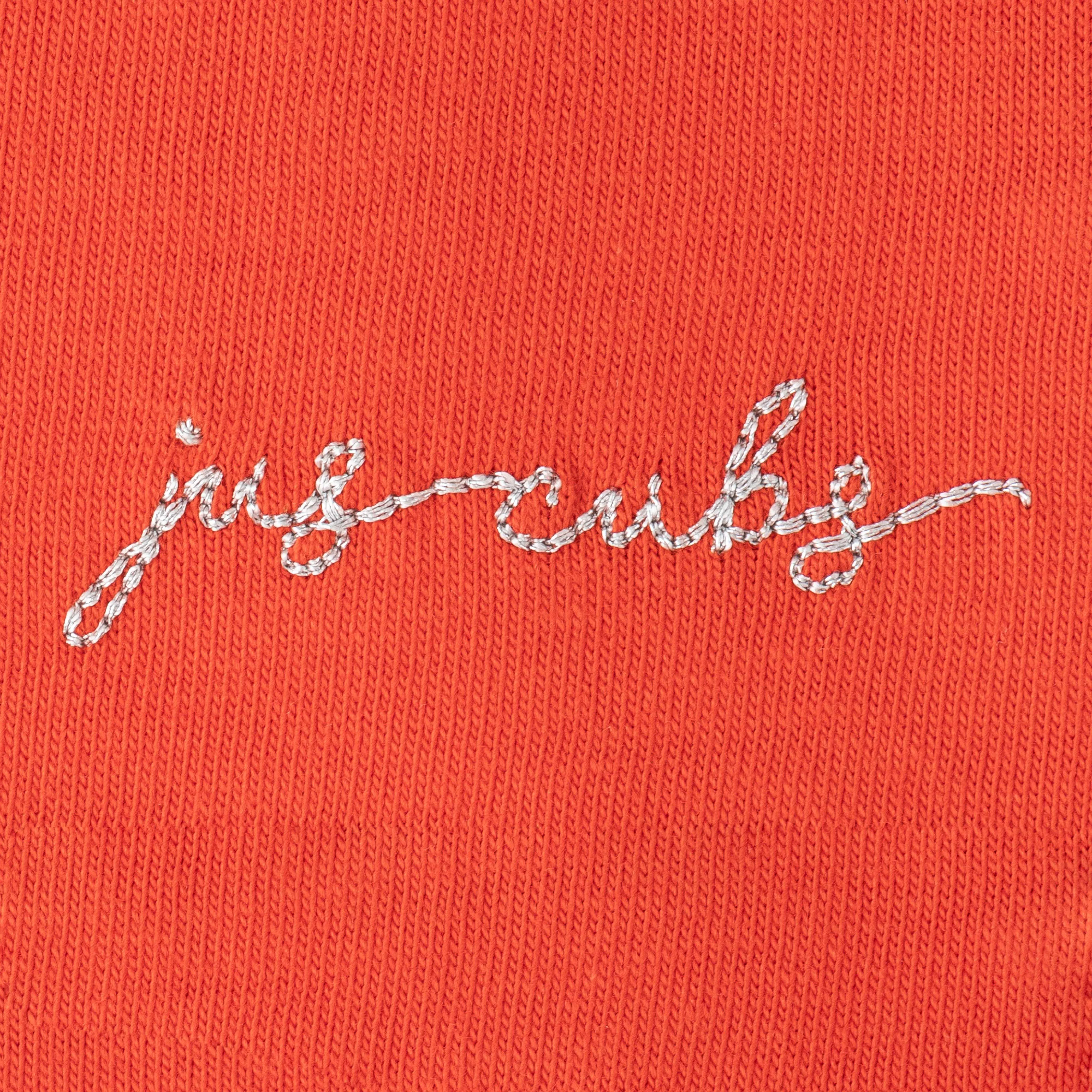 "Girls' Orange Solid Polo T-Shirt with Ruffled Button Placket , White Collar & Embroidered Logo"